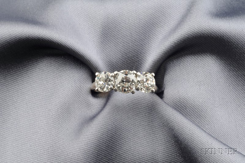 Appraisal: Three-stone Diamond Ring centering a prong-set old mine-cut diamond weighing