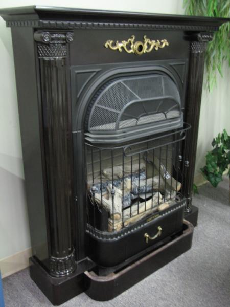 Appraisal: Freestanding Gas Fireplace with cast metal surround black