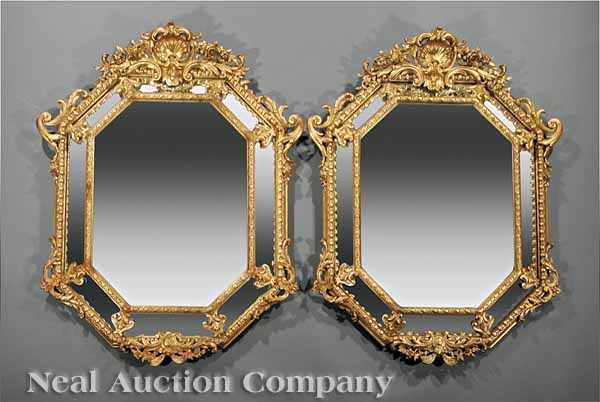 Appraisal: A Pair of Louis XVI-Style Carved Giltwood Mirrors shell and