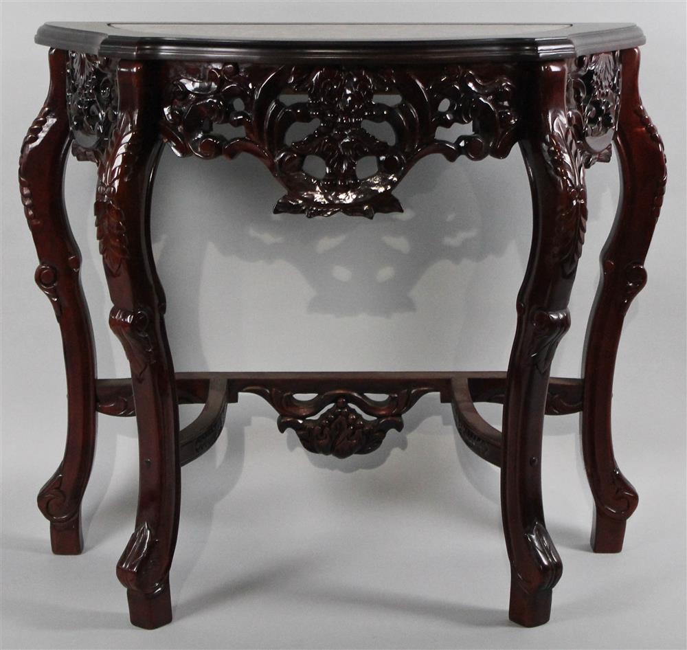 Appraisal: CHINESE CARVED EBONIZED WITH MARBLE INSET CONSOLE TABLE with demilune