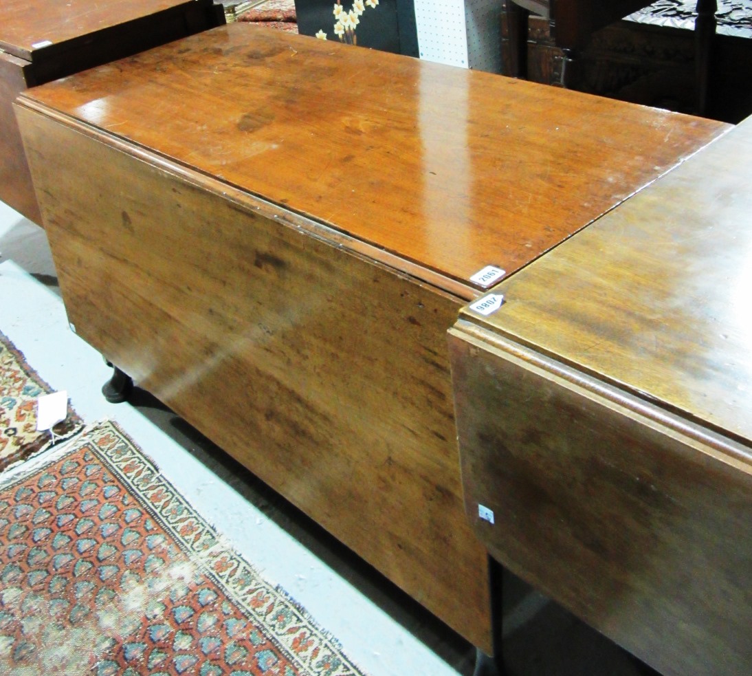 Appraisal: A th century mahogany drop flap dining table