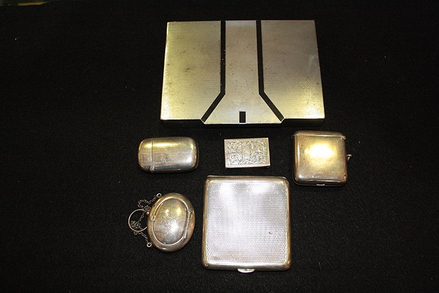 Appraisal: A SILVER CIGARETTE CASE with engine turned decoration two silver