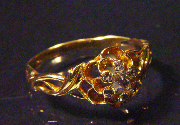 Appraisal: Gold and diamond pierced floral ring