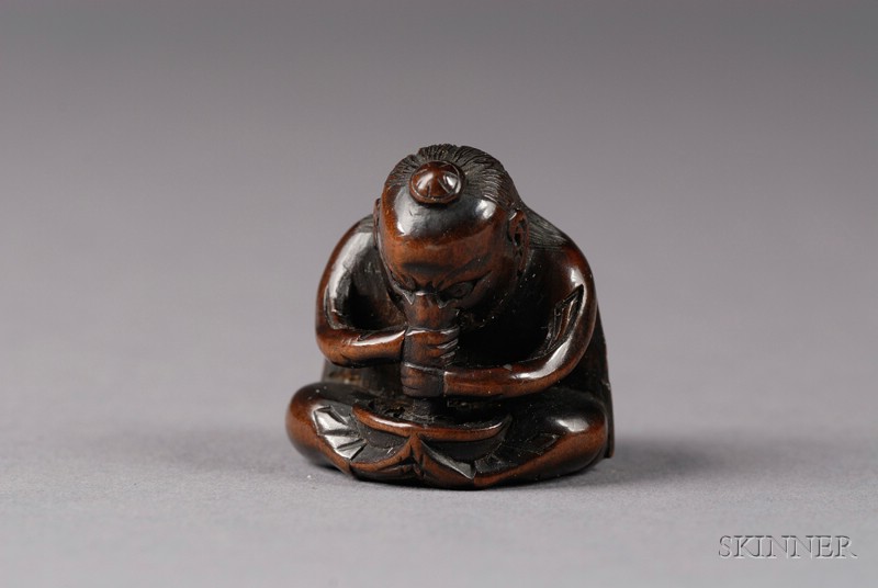 Appraisal: Dark Hardwood Netsuke th century study of a seated Tengu