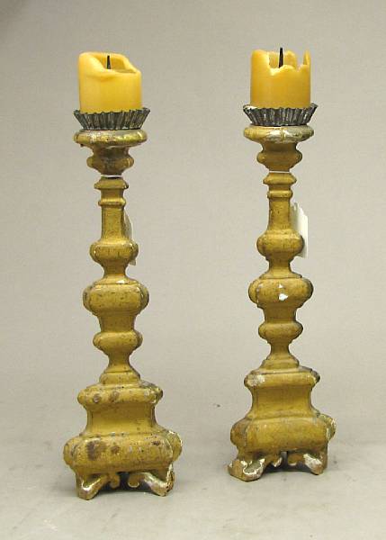 Appraisal: A pair of Italian Baroque giltwood candle prickets th century