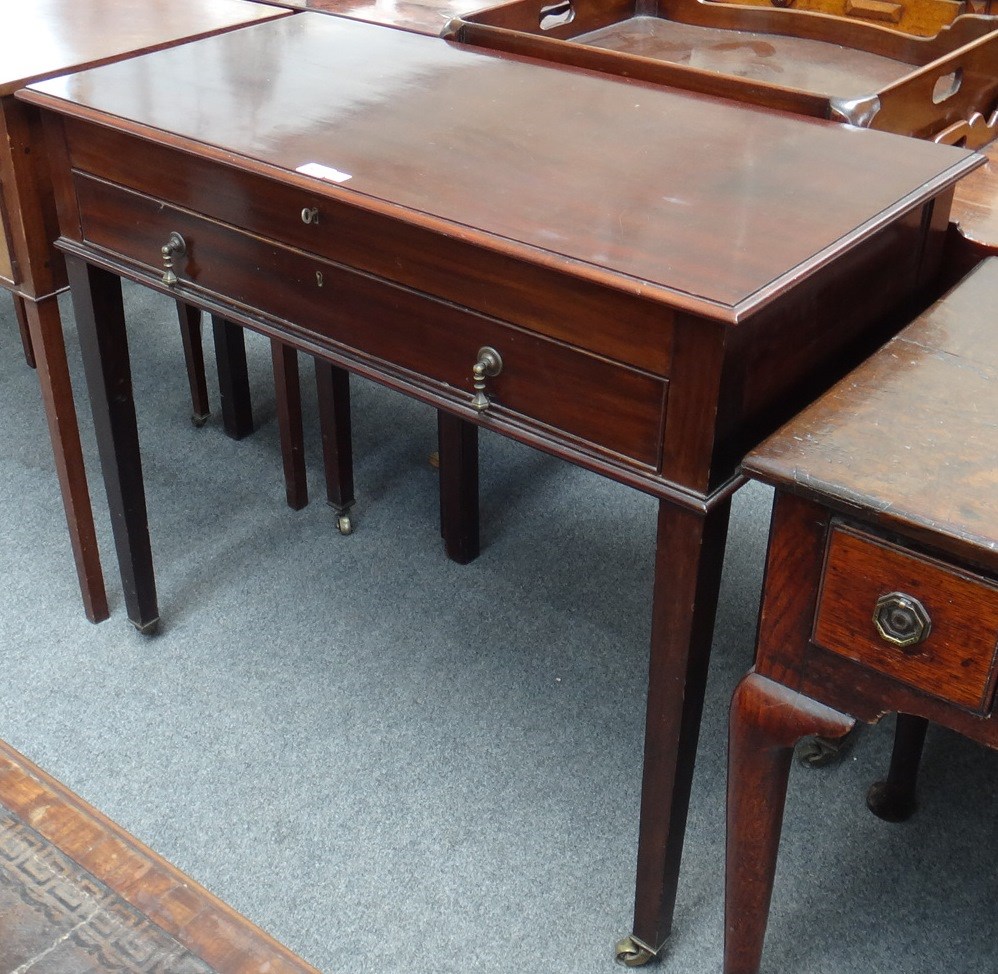 Appraisal: A th century mahogany cutlery cabinet with lift top and