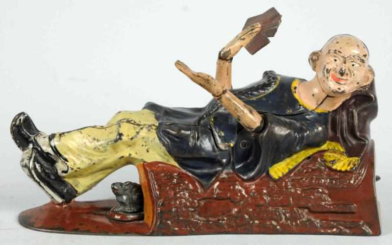 Appraisal: Cast Iron Reclining Chinaman Mechanical Bank Manufactured by J E