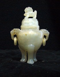 Appraisal: A jade tripod vessel and cover decorated with loose ring