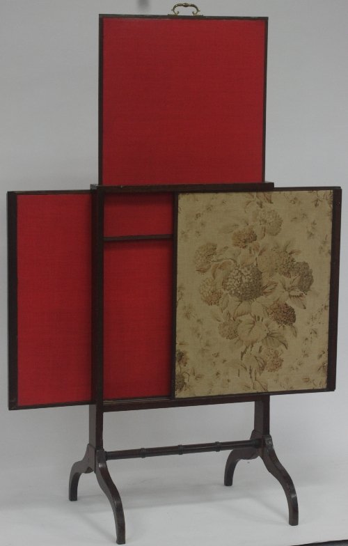 Appraisal: An Edwardian fire screen fitted three sliding panels on downswept