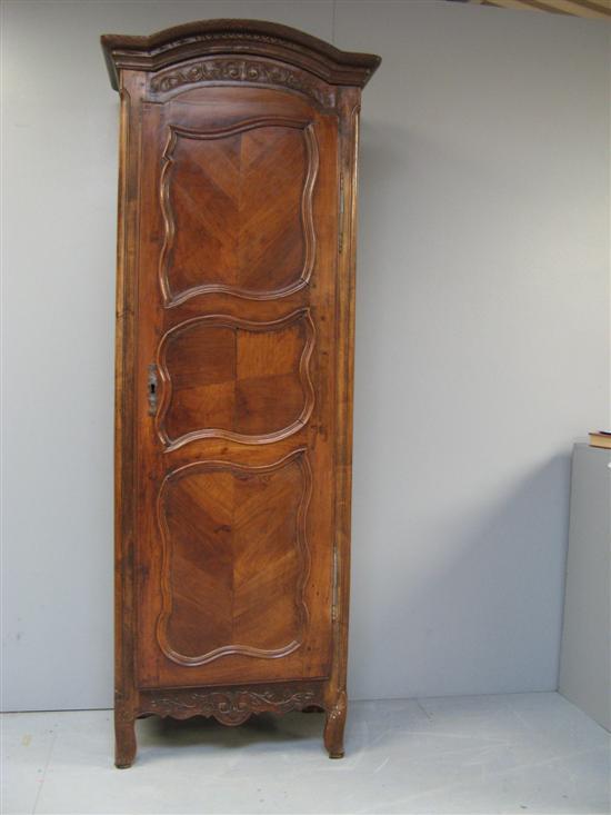 Appraisal: French oak and walnut single armoire th century with domed