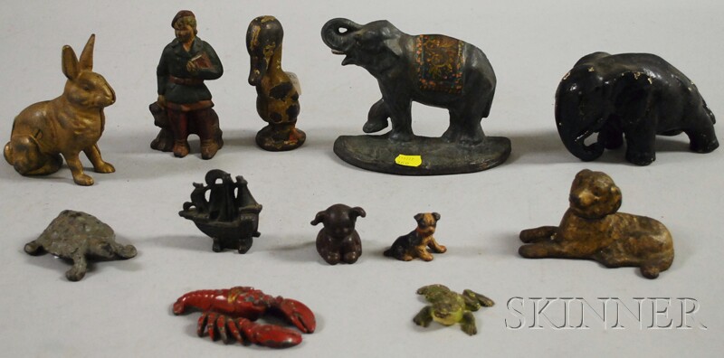 Appraisal: Twelve Assorted Cast Iron and Metal Figurals including banks doorstops