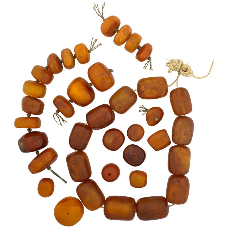 Appraisal: GROUP OF LARGE ANTIQUE BUTTERSCOTCH AMBER BEADS beads includes Barrels