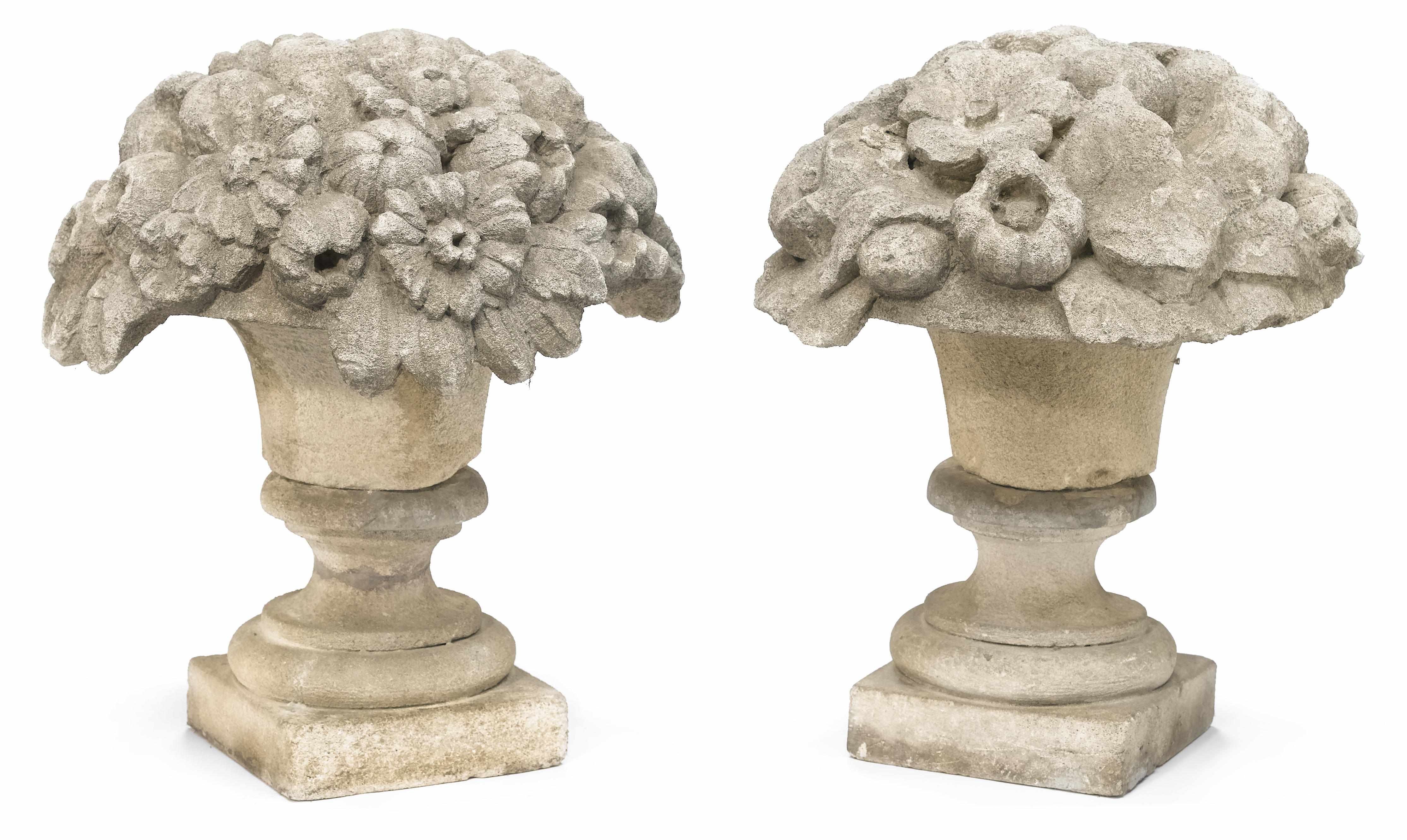 Appraisal: A pair of Neoclassical style carved stone fruit and floral