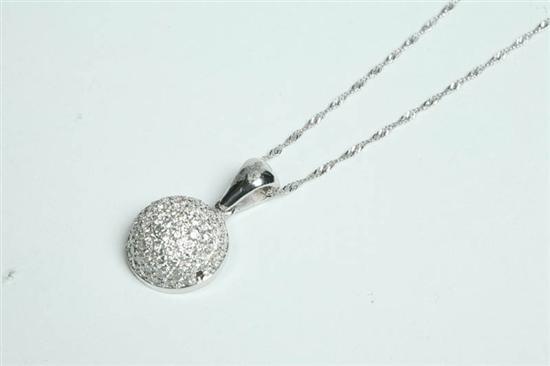 Appraisal: DIAMOND HALF DOME PENDANT White gold pendant with a total