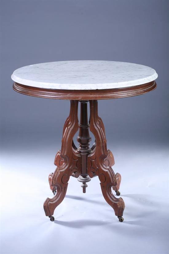 Appraisal: VICTORIAN OVAL MARBLE-TOP TEA TABLE th Century Molded Carrera slab