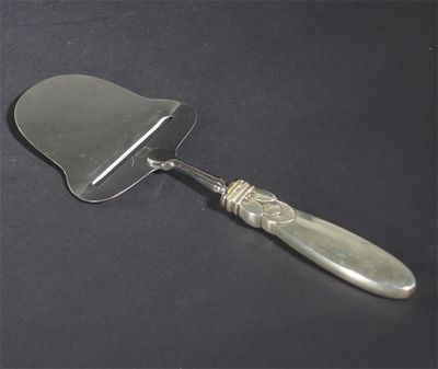 Appraisal: A Georg Jensen Cactus silver cheese parer stamped marks cm