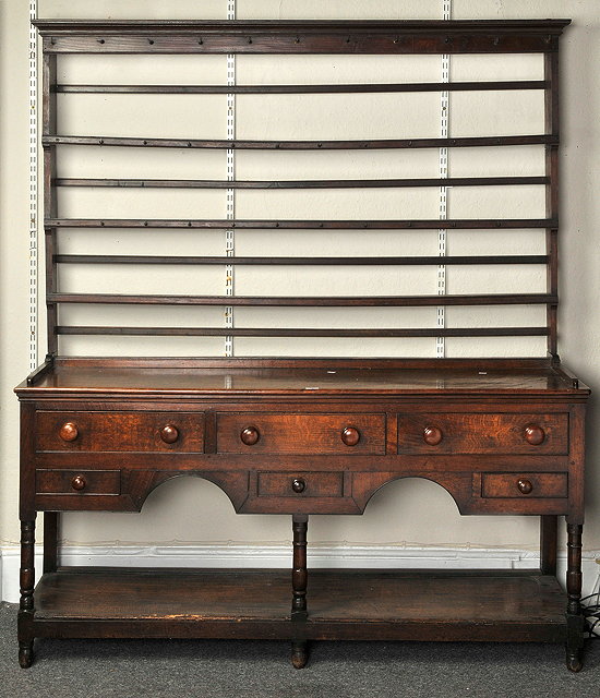 Appraisal: A TH CENTURY OAK DRESSER the top having three shelf