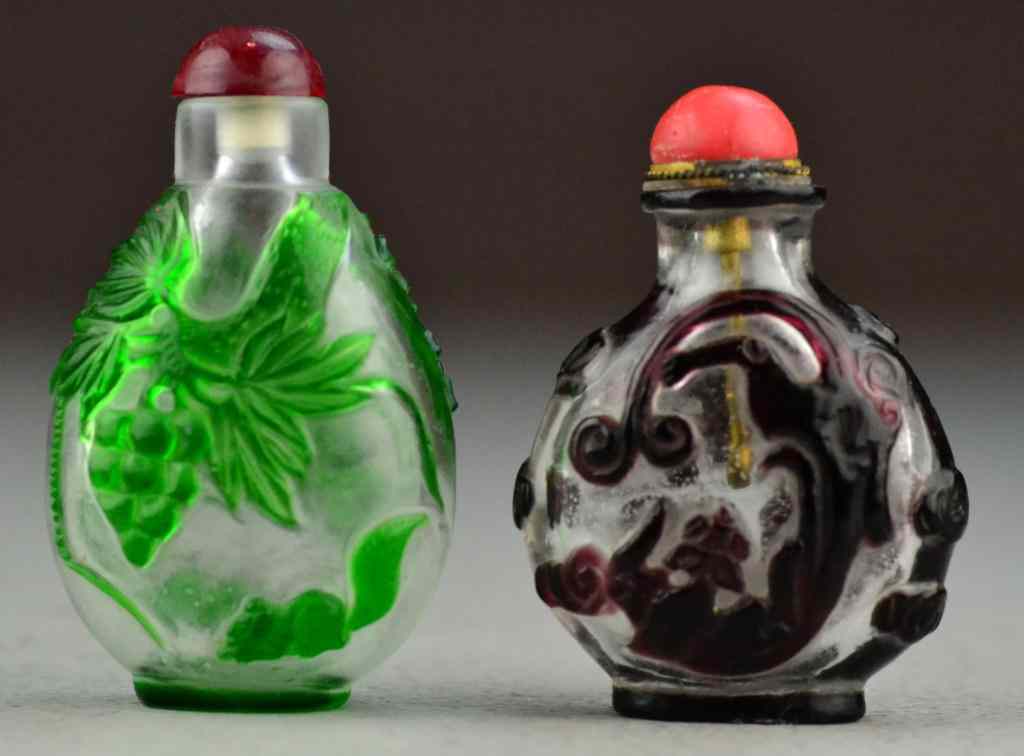 Appraisal: Chinese Peking Glass Snuff BottlesOne deicting squirrel under grabe vine