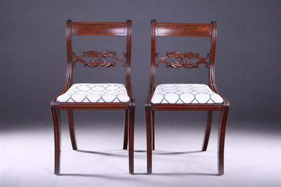 Appraisal: PAIR NEOCLASSICAL STYLE CARVED WALNUT KLISMOS SIDE CHAIRS th century