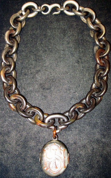 Appraisal: Tortoiseshell mourning pendant necklaceLarge links finishing in locket displaying initials