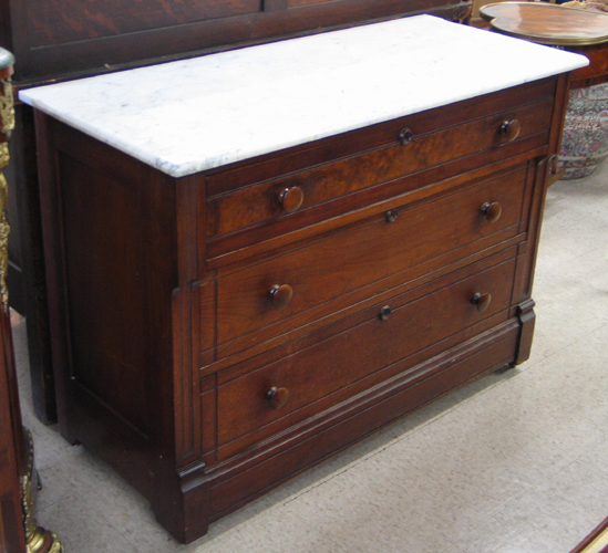 Appraisal: A VICTORIAN MARBLE-TOPPED WALNUT CHEST OF DRAWERS Eastlake design American