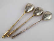 Appraisal: Three Russian silver teaglass spoons with gilt bowls and niello