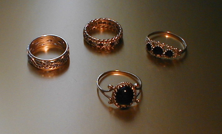 Appraisal: Four assorted gold dress rings