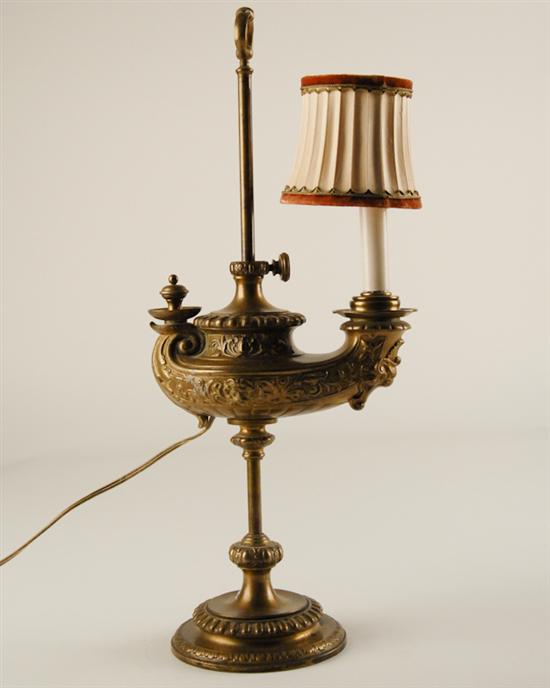 Appraisal: A Genie-form Table Lamp brass ornate foliate motif central rod