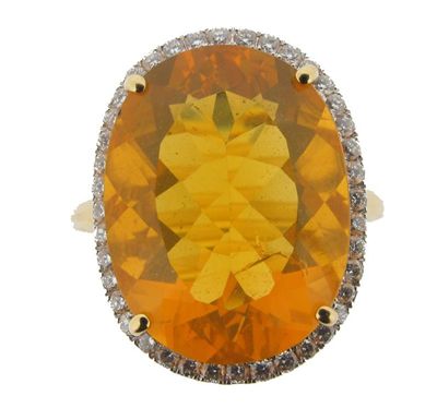 Appraisal: A fire opal and diamond cluster ring The oval shaped