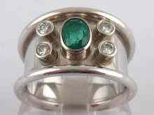 Appraisal: A white metal tests carat gold emerald and diamond ring