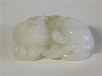 Appraisal: Chinese white jade carving of a Fu lion th century