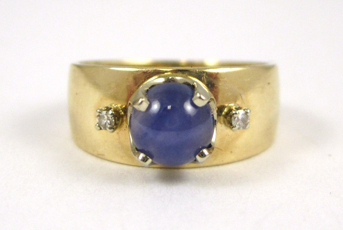 Appraisal: SYNTHETIC STAR SAPPHIRE AND DIAMOND RING k yellow gold set