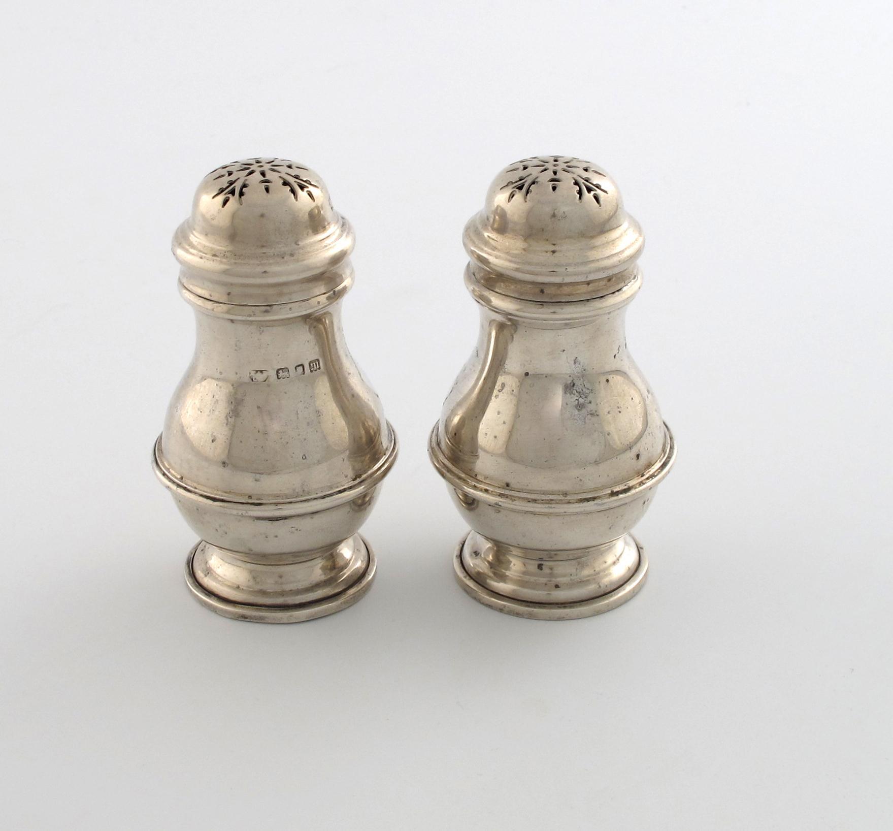 Appraisal: A pair of silver pepper pots