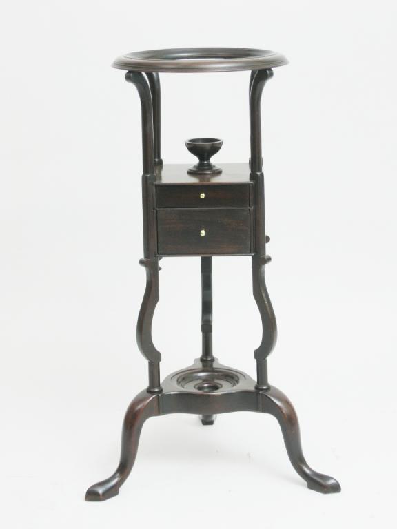 Appraisal: A Georgian mahogany Washstand with circular top above two small