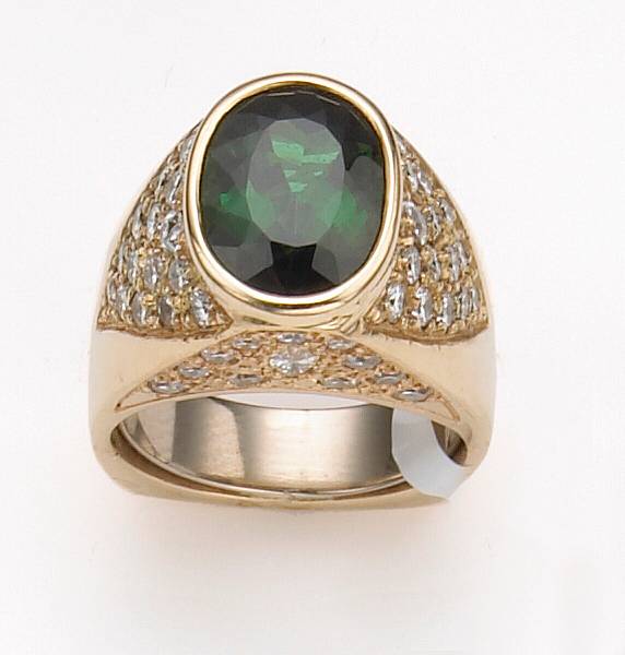 Appraisal: A green tourmaline diamond and fourteen karat gold ring centering