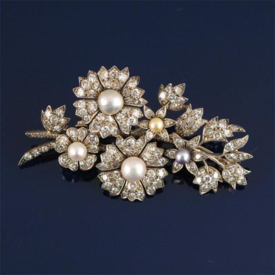 Appraisal: A late Victorian diamond and pearl set floral brooch the