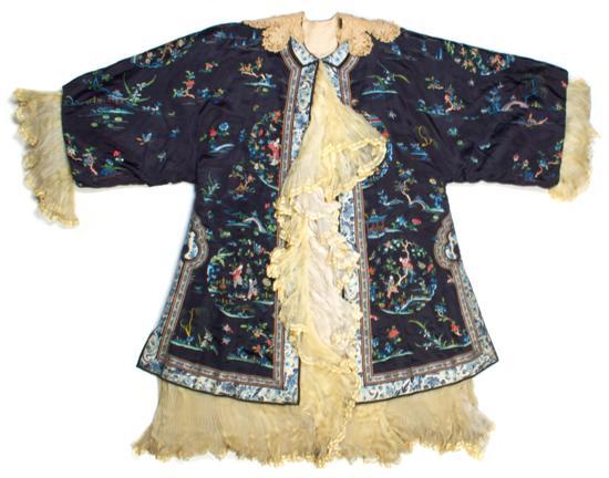 Appraisal: A Chinese Embroidered Lady's Informal Overcoat having navy reserve with