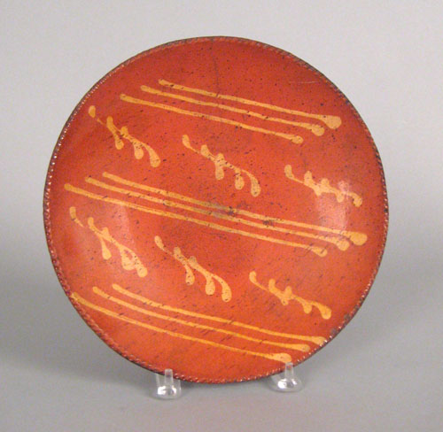 Appraisal: Redware charger th c with yellow slip decoration dia