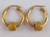 Appraisal: A pair of yellow metal tests carat gold hoop earrings