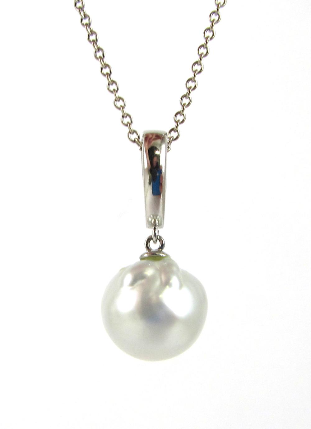 Appraisal: PEARL AND FOURTEEN KARAT GOLD PENDANT NECKLACE with an -