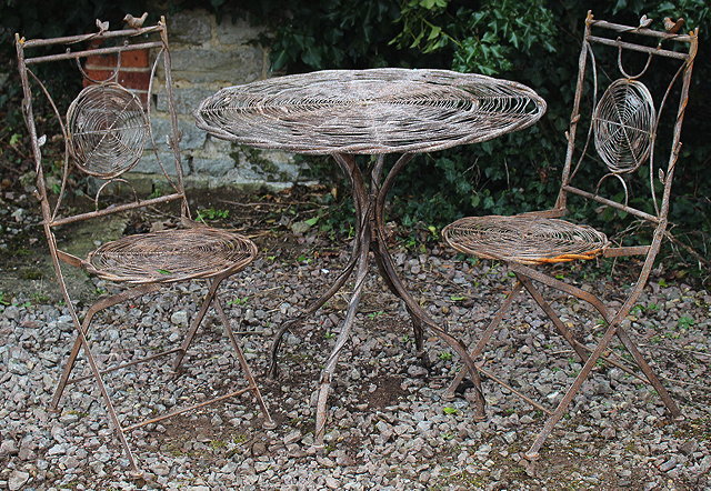 Appraisal: A BROWN PAINTED WIRE WORK BISTRO SET in the form