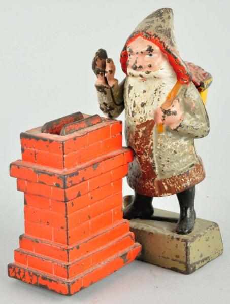 Appraisal: Cast Iron Santa at Chimney Mechanical Bank Description Manufactured by