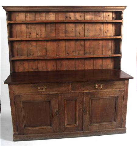 Appraisal: A Welsh matched pine dresser the projected moulded cornice over