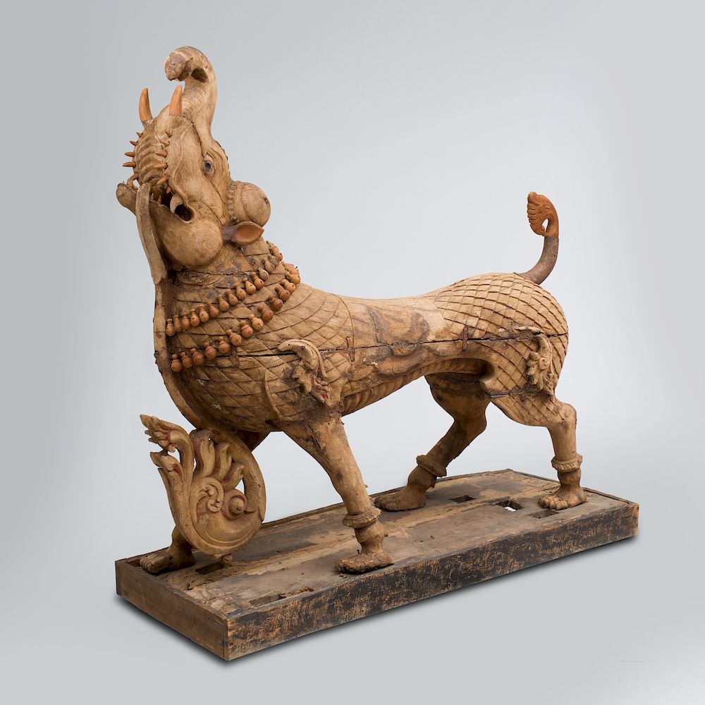 Appraisal: Indian Carved Hardwood Model of a Mythological Animal Raised on