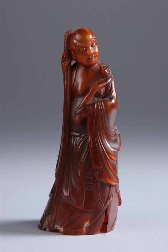 Appraisal: CHINESE HORN FIGURE OF IMMORTAL th century Holding ruyi sceptre