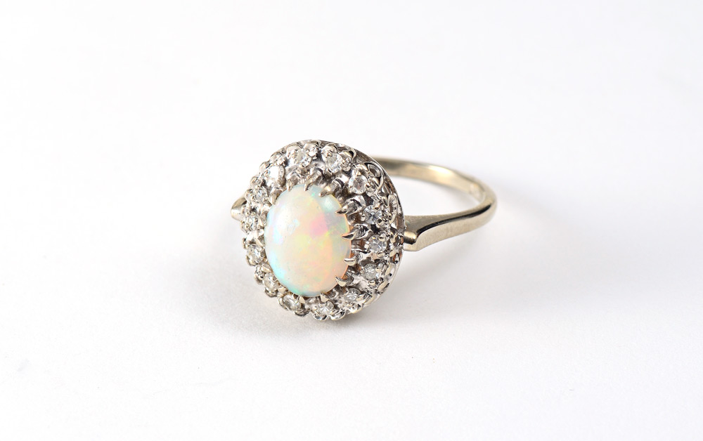 Appraisal: OPAL DIAMOND RING K white gold ring centers one oval