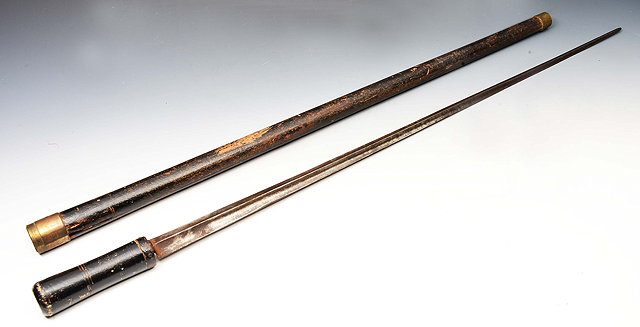 Appraisal: AN ANTIQUE SWORD STICK with engraved steel blade and black