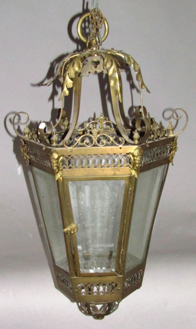 Appraisal: A Victorian gilt brass hanging lantern with scroll framework satyr