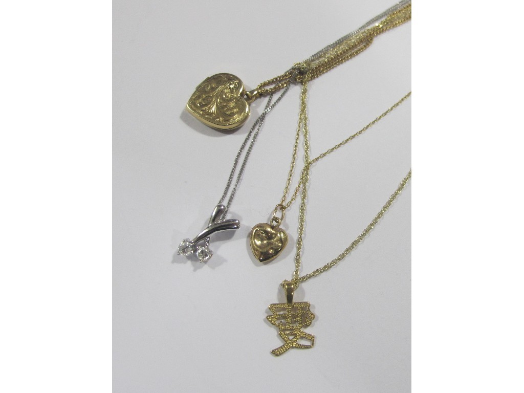 Appraisal: Four ct gold pendants all on gold neckchains Approximately gms