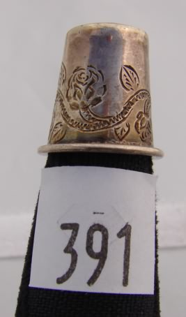 Appraisal: Silver tone thimble with floral vine design